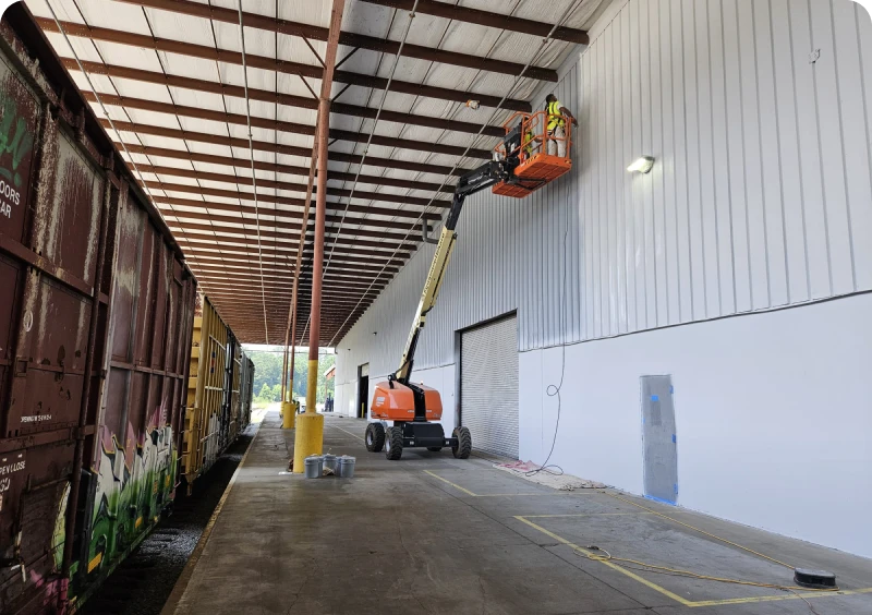 Train and construction lift at platform
