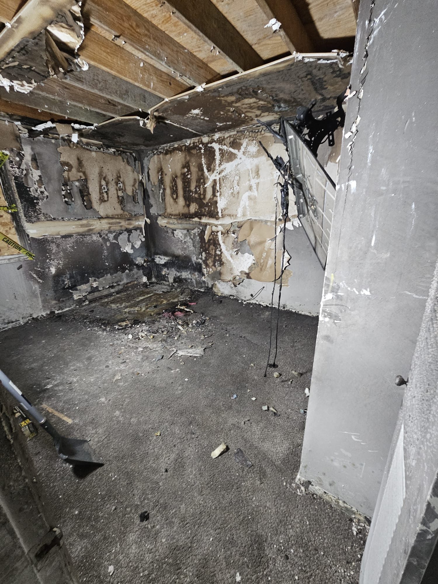 Charred interior with peeling walls and ceiling