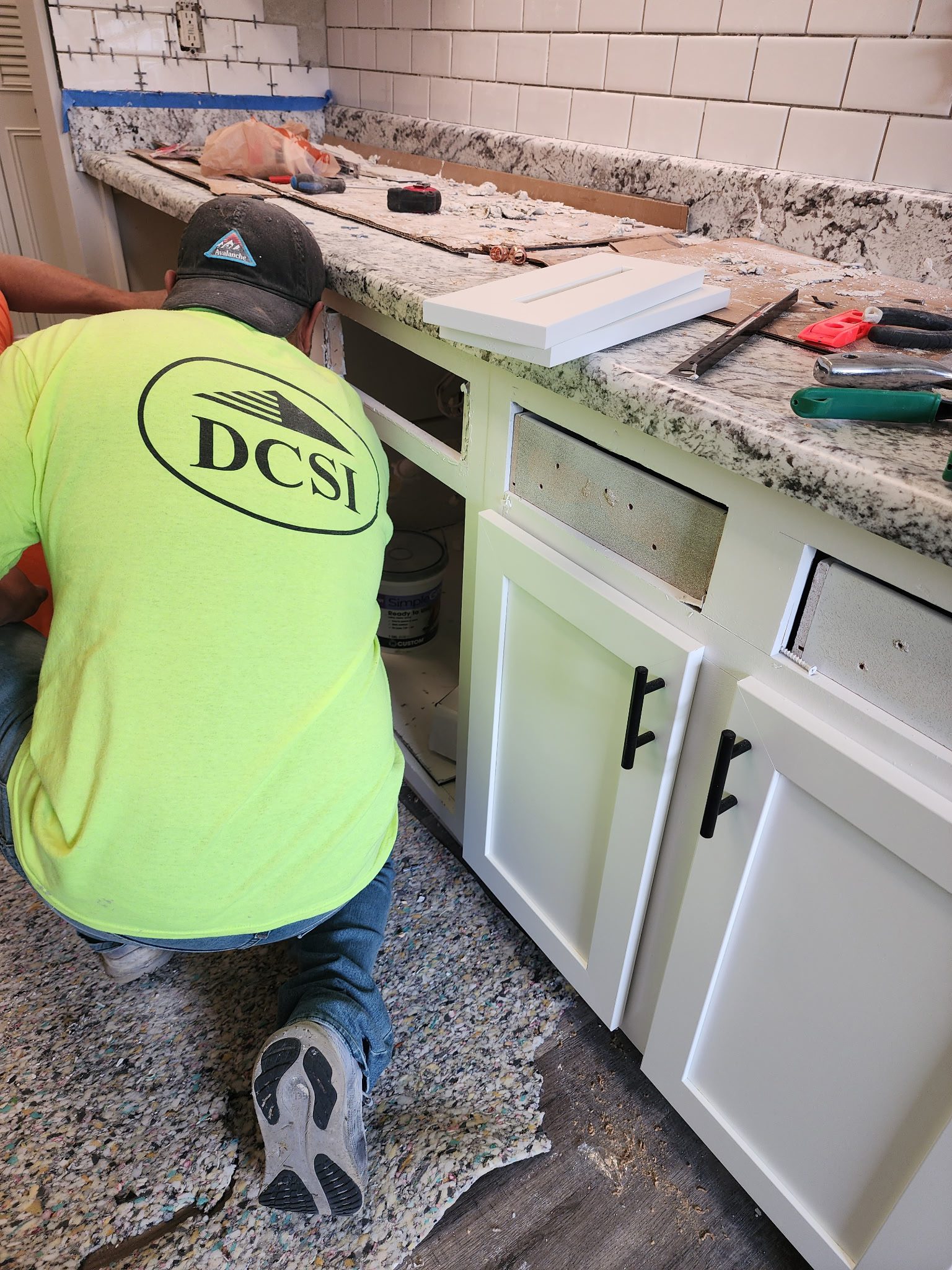 Assembling cabinets in kitchen
