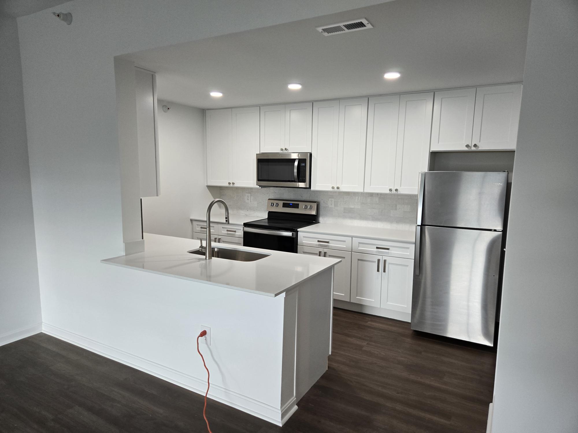Sleek kitchen with stainless steel appliances