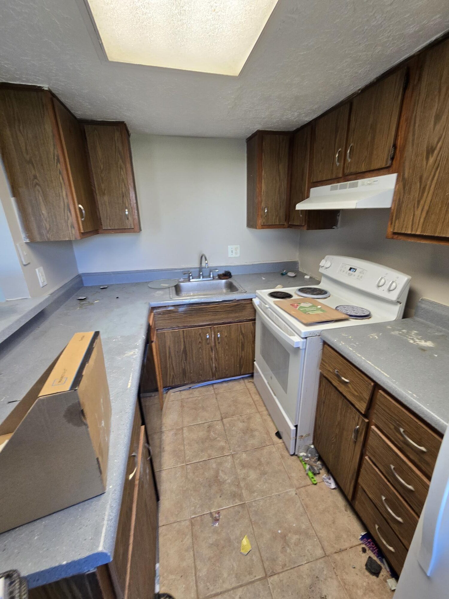 Compact kitchen space with tiled floor