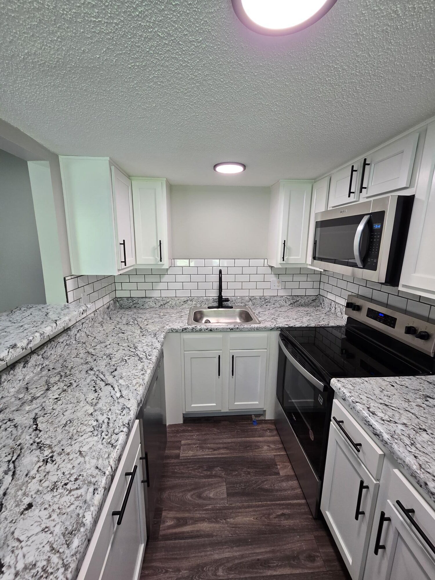 Compact kitchen with stainless steel appliances