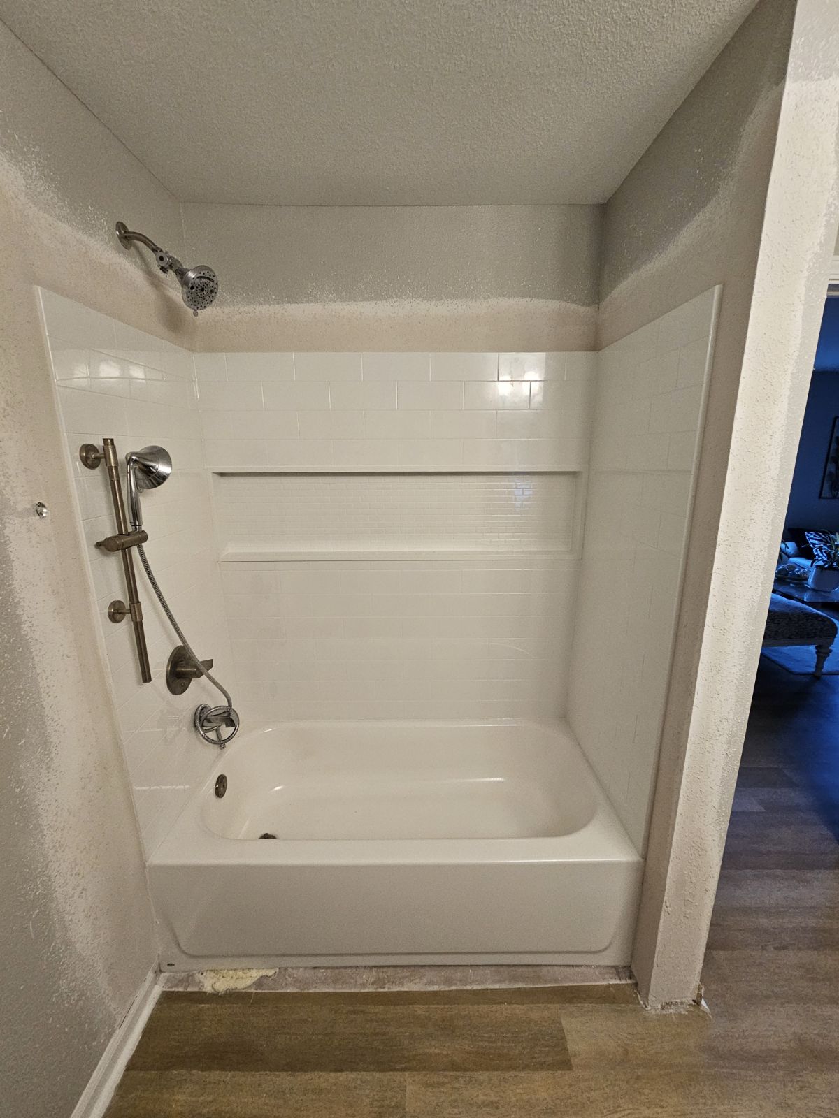 Newly installed bathtub with shower fixtures