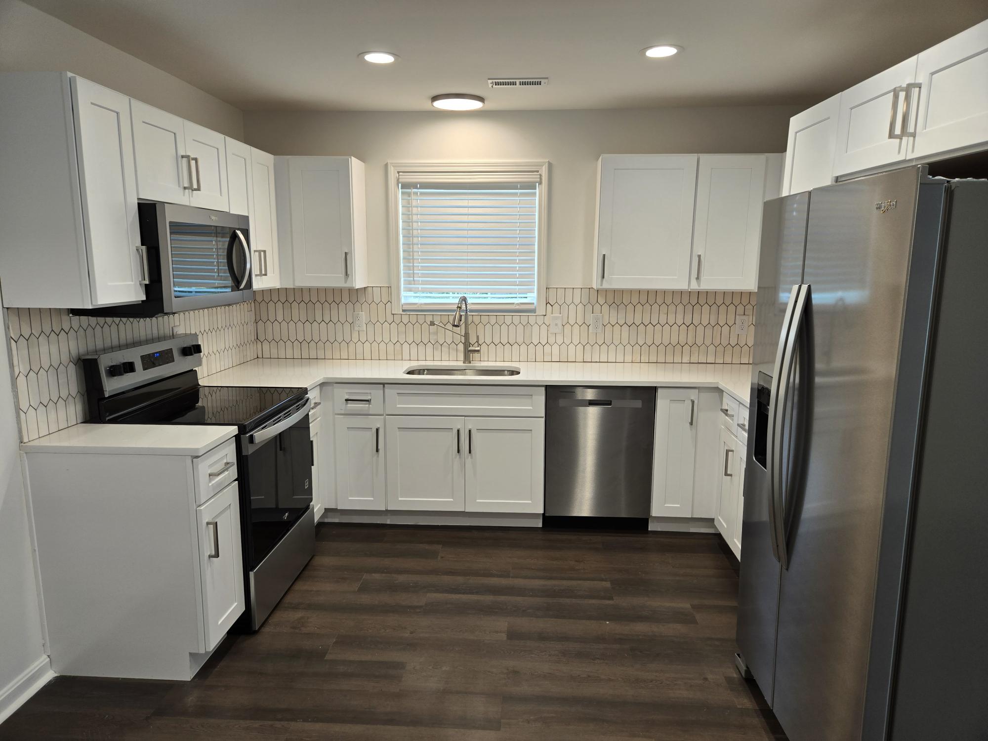 Modern kitchen with white cabinets